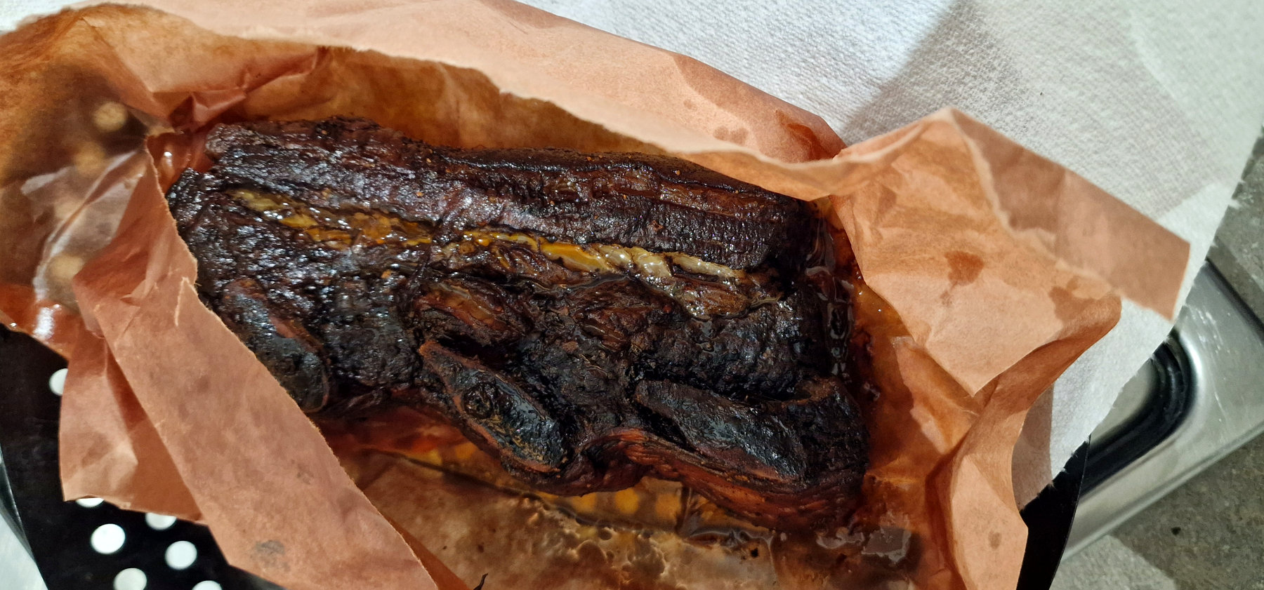 Smoked beef ribs resting in butcher paper after the first long Borniak cook
